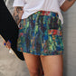 TEENAGE DIRTBAG SPLATTER PAINT DENIM SKORT